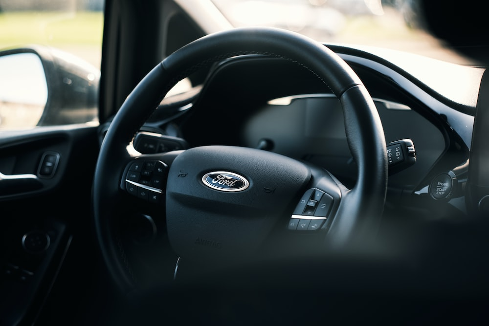 A close up of the steering wheel of a car.
