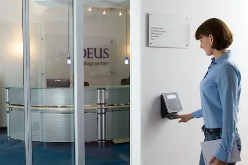 A person entering a room through an access control system