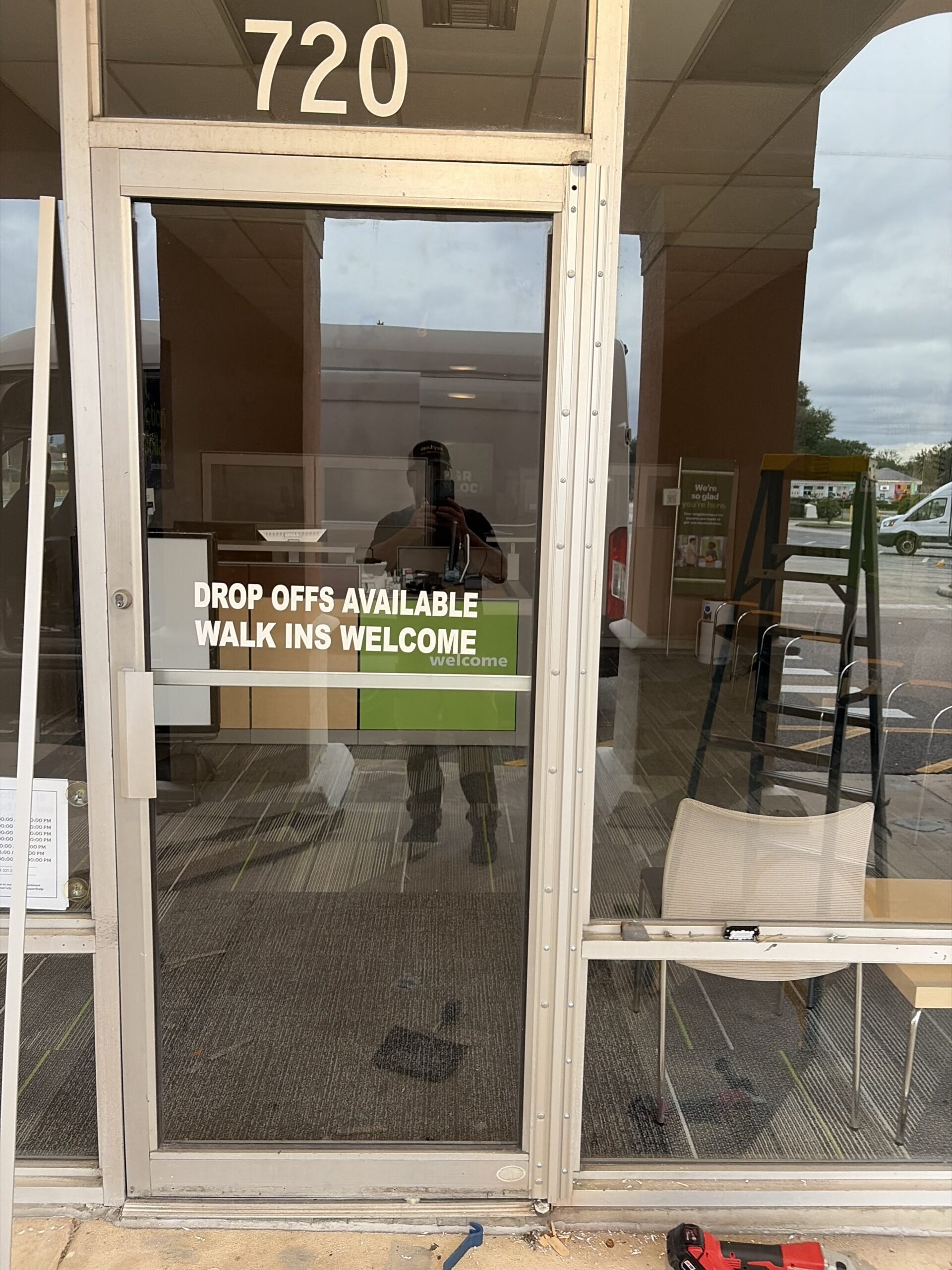 Roton continuous hinge installation replacing pivot hinge on commercial door by Key-En-Lock Brevard County FL