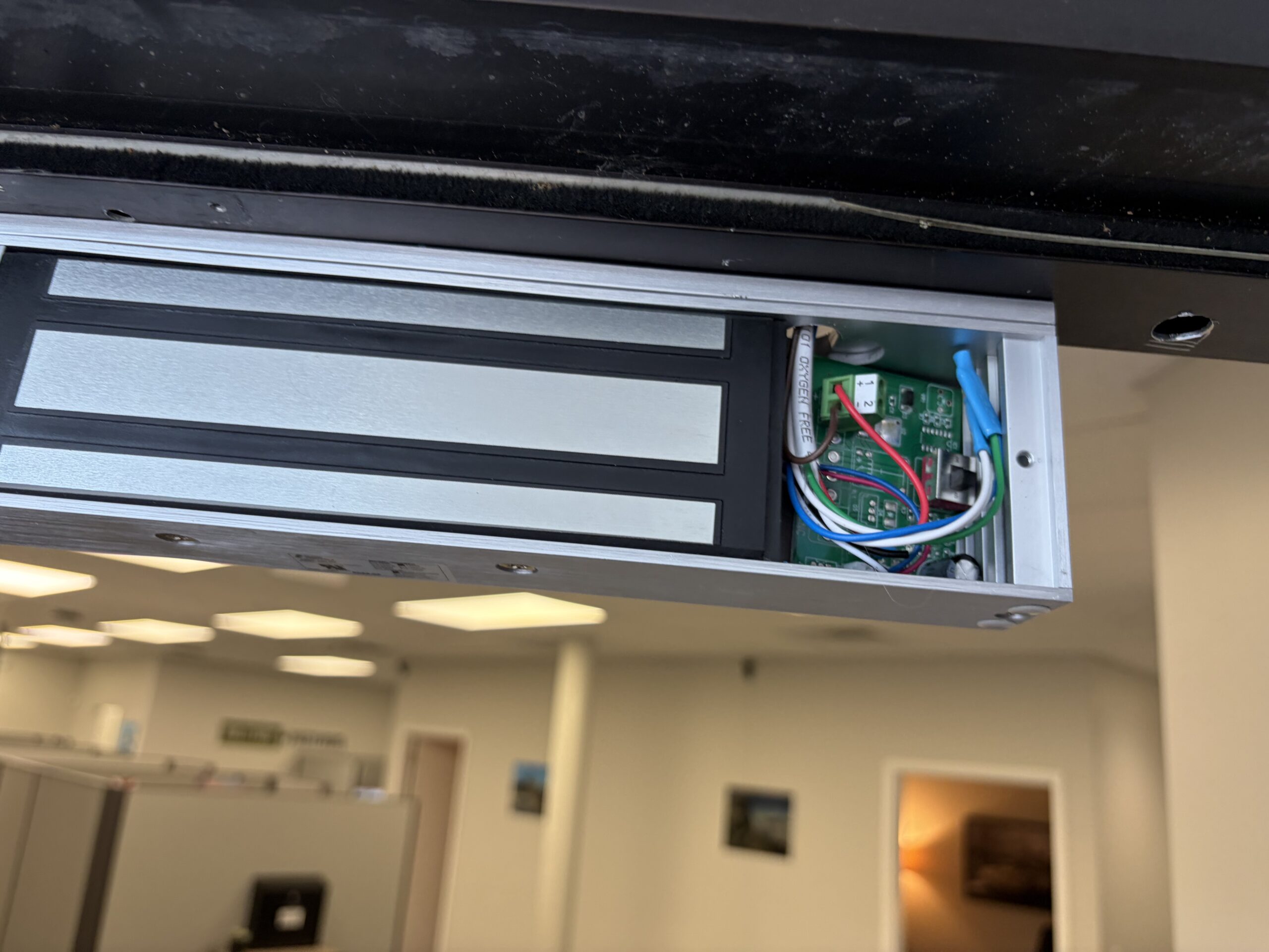 Magnetic lock installed on commercial door frame by Key-En-Lock Brevard County FL access control