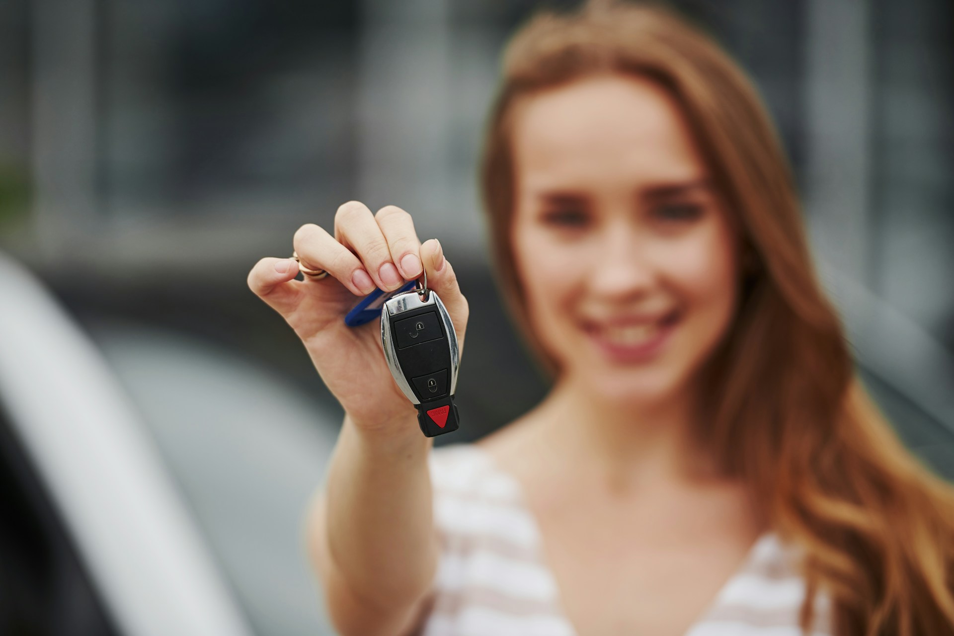 woman holding car keys
